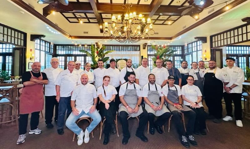 Chef Charles Davis with a large group of chefs and culinary professionals